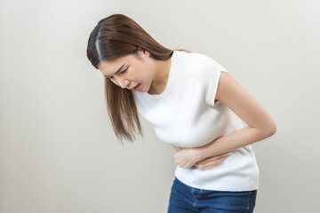 Flatulence asian young woman intolerance hand in stomach ache, suffer from food poisoning,...