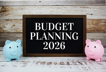Budget Planning 2026 typography text message with piggy saving on wooden background
