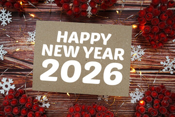 Happy New Year 2026 text on paper craft with LED and