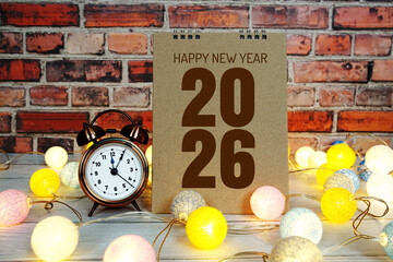Happy New Year 2026 text message with alarm clock and LED cotton balls decoration