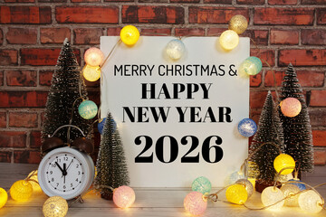 Happy New Year 2026 text message with alarm clock and LED cotton balls decoration