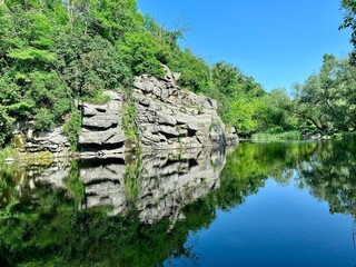 A breathtaking view of the Buca Canyon in Ukraine, a winding river flowing between high rocky banks...