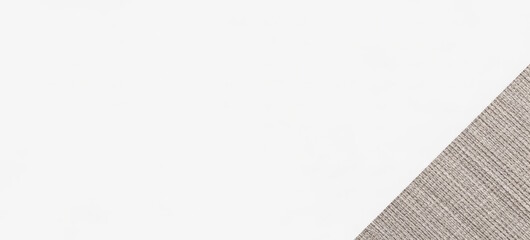 Light brown textured fabric on a white background, partially covering the bottom right corner of the image.