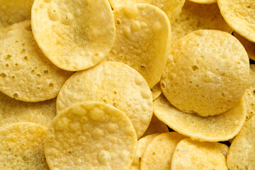 Fresh crispy potato chips. Junk food product. Close up