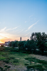 Warm sunset light over the Arno River and historic buildings of Florence, Tuscany, Italy