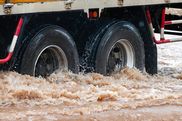 Flooded streets pose serious risks to vehicles, emphasizing the importance of comprehensive auto insurance.