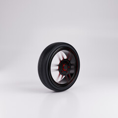 Car wheel spinning in motion with red accents on a white background
