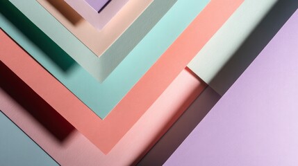 Top-down view of pastel paper sheets layered with geometric composition, soft shadows, copy space