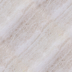 A close-up of light beige marble with subtle textures, organic specks, and delicate flowing patterns