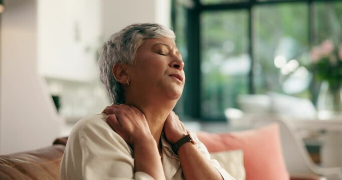 Senior woman, stretching and neck pain on sofa with arthritis, discomfort or muscle sprain. Retirement, old person and massage tension in home for nerve damage, bad posture or osteoporosis from aging