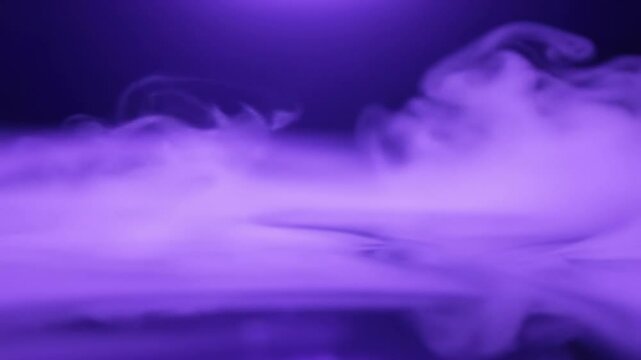 Abstract smoke artwork in purple tones on a dark background  