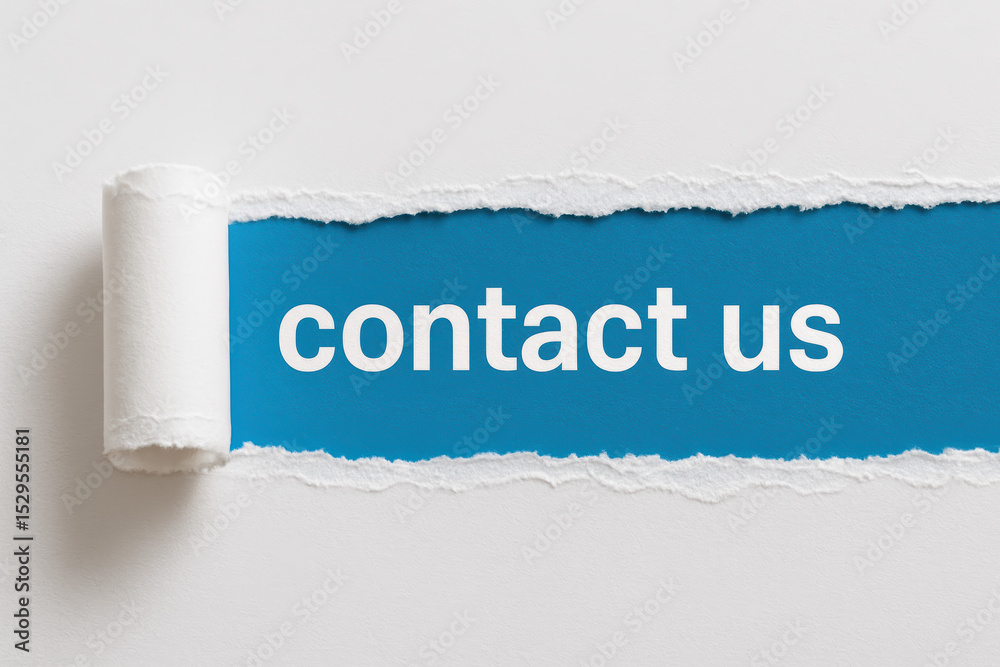 Fototapete a horizontal tear on a white paper surface reveals a bright blue background with text symbolizing co