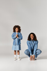 Denim dreams. a mother and daughter are bonding in the studio