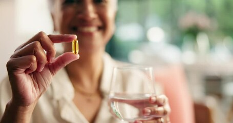Hands, capsule and water for medicine in home, health and wellness with supplements in living room. Mature person, glass and pills for omega 3, benefits and pharmaceutical product in morning at house - Powered by Adobe