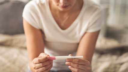 Woman waiting for pregnancy test result