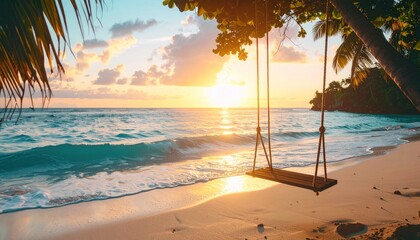 Beach swing at sunset with turquoise waves, bright sun and palm trees