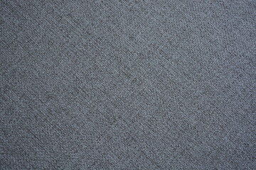 Things, objects, fabric backgrounds. Beautiful dense gray quality fabric with dark inclusions.
