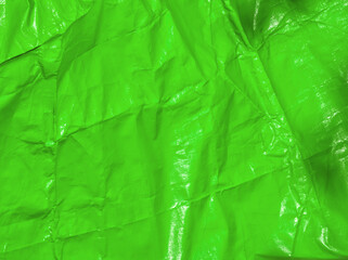 Green background. Green lime tarpaulin PVC background. Green aesthetic. Green plane surface....