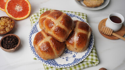 Flat Lay of Zesty Hot Cross Buns in Rustic Setting