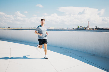A Refreshing Morning Jog Alongside the Waterfront, Surrounded by Vibrant Blue Skies and...