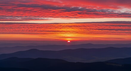 Obraz premium Majestic Sunrise Over Layered Mountain Ranges