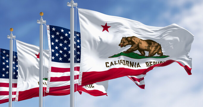 California state flags and the American flag waving in the wind