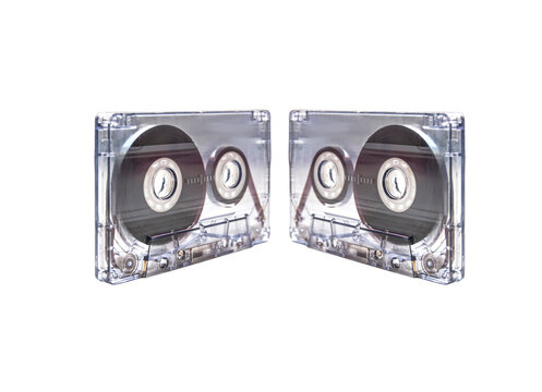 Two transparent audio cassette tapes on white background