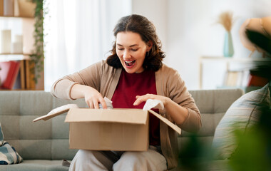 Woman is unpacking cardboard
