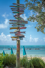 Key West Florida. Mileage signpost on Key West. Fort Zachary Taylor State Park. Florida best beaches. Beach vibes. Tropical nature. Summer, winter, spring, autumn or fall vacations. Atlantic ocean