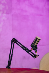 Engaging podcast setup featuring microphone and headphones in vibrant studio environment