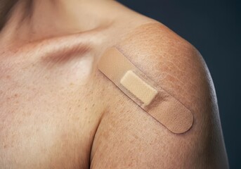 Plaster on a person's shoulder