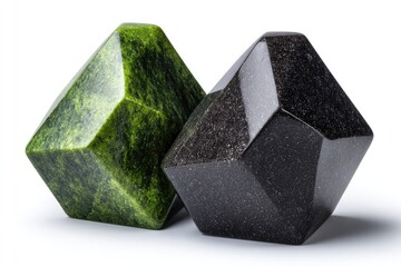 Two sculpted stone objects of contrasting colors.