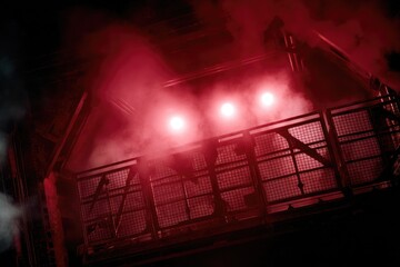 Mysterious Industrial Scene with Red Lights and Fog Atmosphere