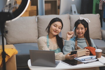 Young asian women happy after new order from customer. Surprise and shock face of asian woman success on making big sale of his online store. Online Selling. Online Shopping