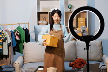 Young asian women happy after new order from customer. Surprise and shock face of asian woman success on making big sale of his online store. Online Selling. Online Shopping