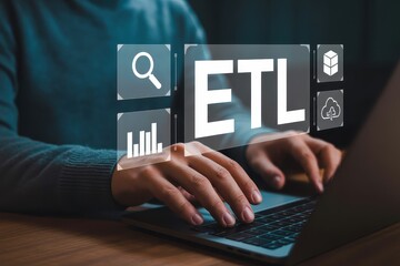 Person using a laptop computer with etl interface displayed.