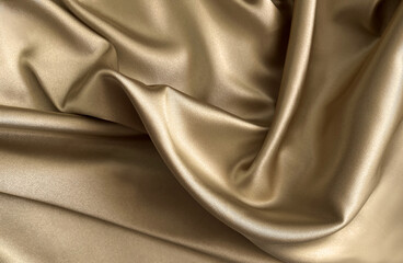 Brushed gold, cream, gold shimmer, gold lustre. Luxury shiny  brilliant drape. Premium silk satin fabric with gentle soft folds and wavy texture, Grainy structure. Beige brown light coffee color.