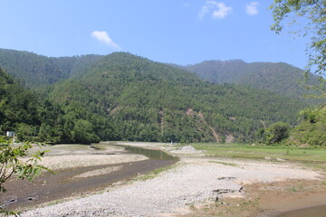 Low flow of water in mountainous river due to  global warming