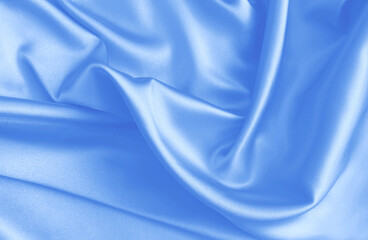 Light blue silk fabric with glossy waves and gentle wrinkles. Ideal for beauty branding, wedding invitations, or digital designs needing a soft, luxurious, and calm aesthetic. High-quality draped.