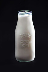 Dairy milk in a bottle on a black background
