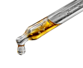 Dropping essential from a glass dropper laboratory clean scientific concept