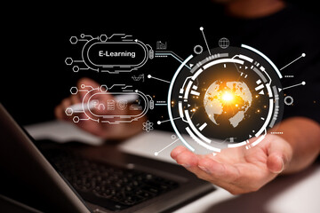 A person uses a laptop with a glowing digital globe and futuristic e-learning interface floating...