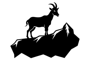 Silhouette of a mountain goat on a peak