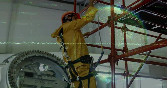 Maintenance technician clipping carabiner onto scaffold beam, stepping up and testing lanyard hold