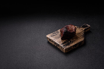 Grilled beef steak meat with salt and pepper. Beef steak grilled on a barbecue