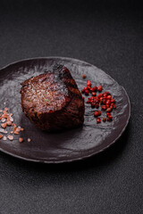 Grilled beef steak meat with salt and pepper. Beef steak grilled on a barbecue