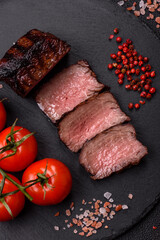 Grilled beef steak meat with salt and pepper. Beef steak grilled on a barbecue