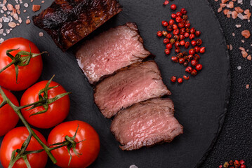 Grilled beef steak meat with salt and pepper. Beef steak grilled on a barbecue
