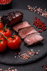 Grilled beef steak meat with salt and pepper. Beef steak grilled on a barbecue