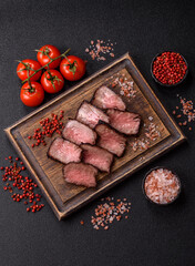 Grilled beef steak meat with salt and pepper. Beef steak grilled on a barbecue
